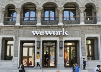 IWG share price could benefit as WeWork stock implodes