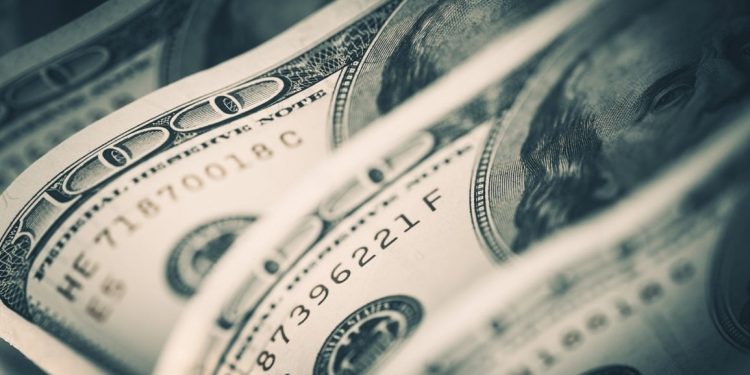 The dollar index, after one year, again below the 100.00