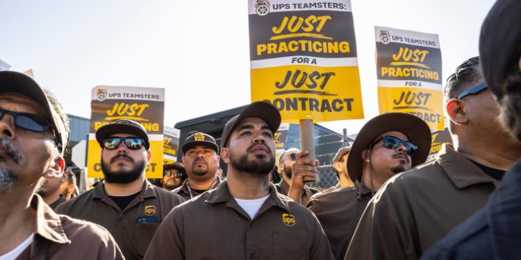 UPS workers overwhelmingly approve new contract, ending strike threat