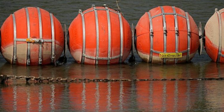Judge orders Texas to remove floating buoys used to curb flow of illegal immigrants