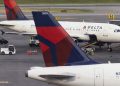 Delta says Hollywood and auto strikes are denting business travel