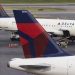 Delta says Hollywood and auto strikes are denting business travel