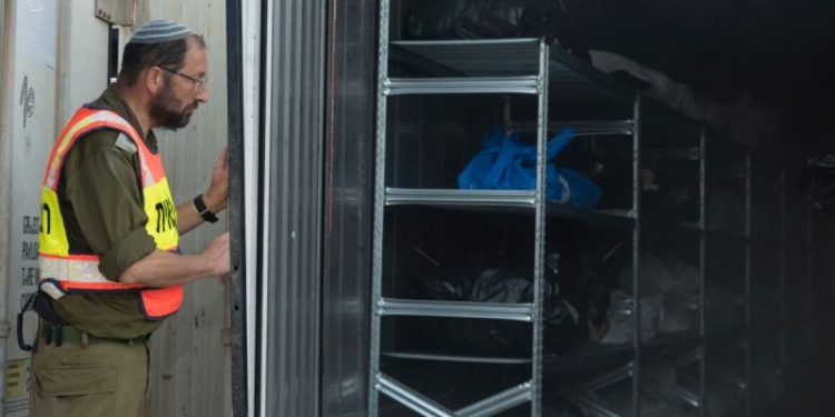 At the army base where Israel identifies its dead: ‘They went from house to house burning family after family’