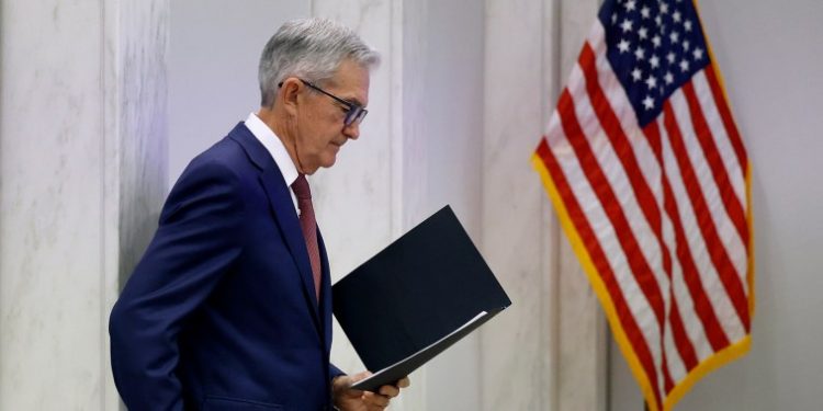 Fed Chair Powell calls talk of cutting rates ‘premature’ and says more hikes could happen