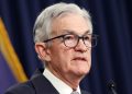 Federal Reserve holds interest rates steady as consumer confidence improves and inflation slows