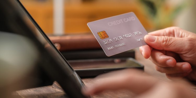 American Express surpasses EPS forecasts and raises guidance, yet shares fall