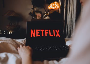 Why is Netflix considering going all-cash for WBD assets?