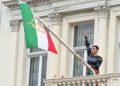 Protester scales Iranian Embassy in London, tears down regime flag, hoists pre-revolution symbol